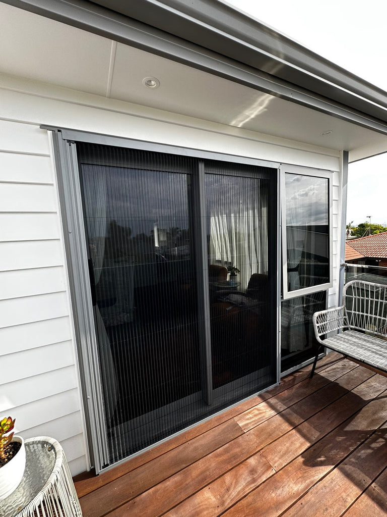 Pleated insect screen installed on a sliding door in a New Zealand home
