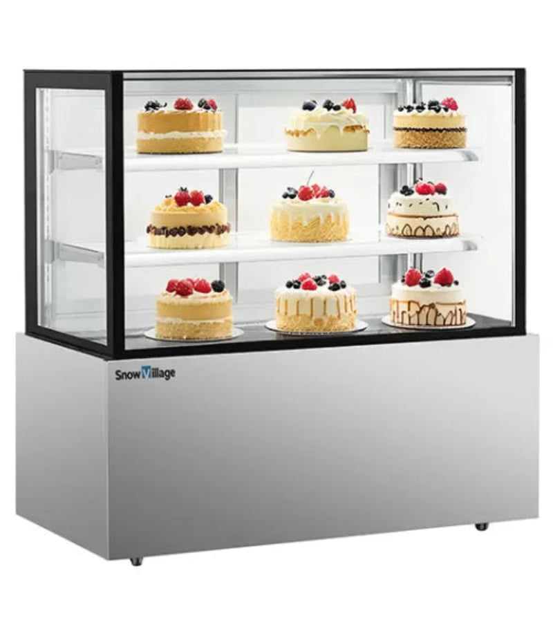 Display case with cakes topped with berries on a white background