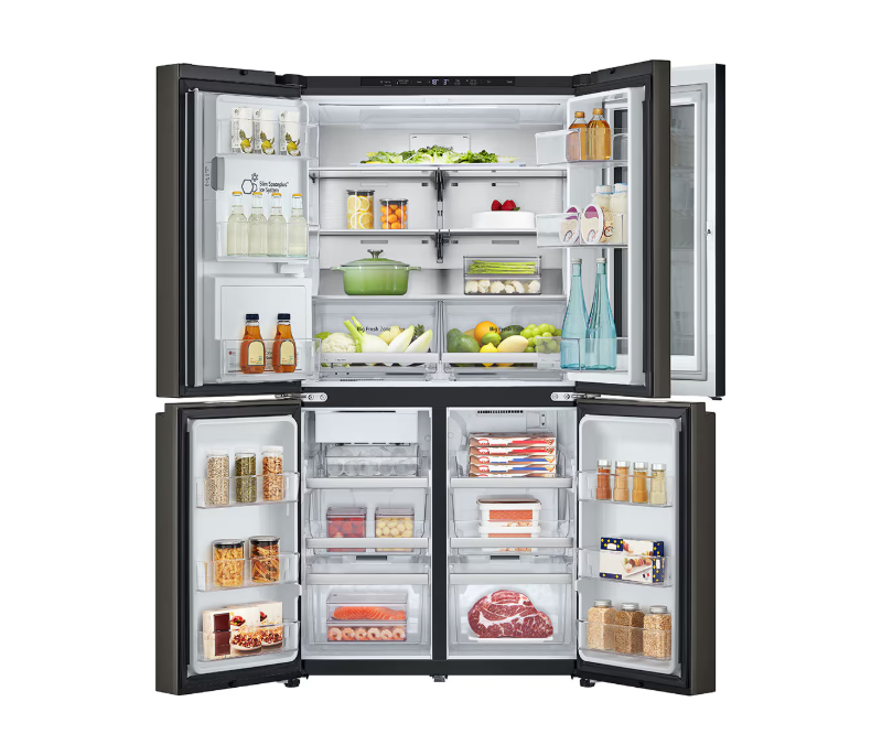 Open multi-door refrigerator with various food items on a white background